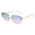 Oversized cat-eye sunglasses with a cream-colored frame and gradient lenses that transition from light blue at the top to soft pink at the bottom.