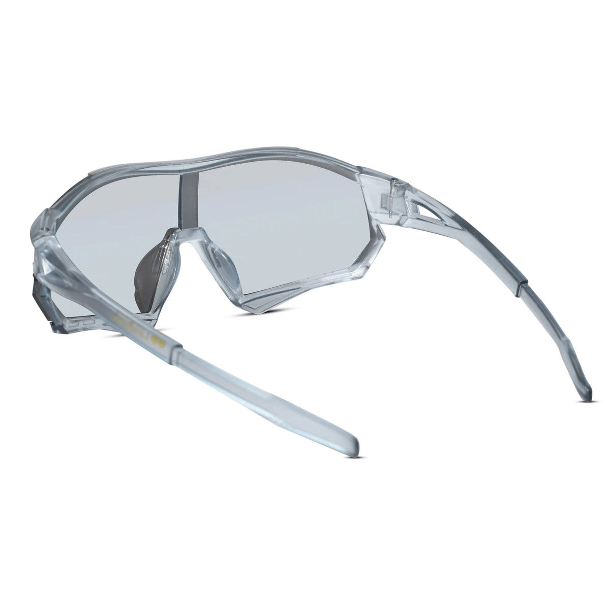 Clear safety glasses with a transparent frame and light gray lenses, shown from a three-quarters angle on a white background.