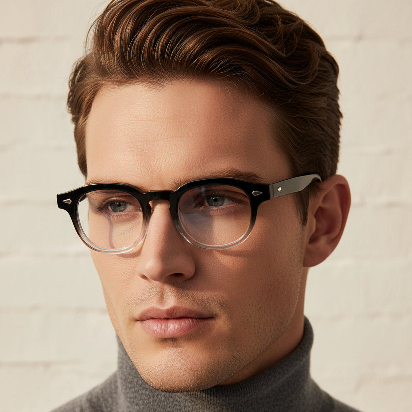 Round eyeglasses with a black-to-clear gradient acetate frame and blue temple tips, shown against a plain white background.