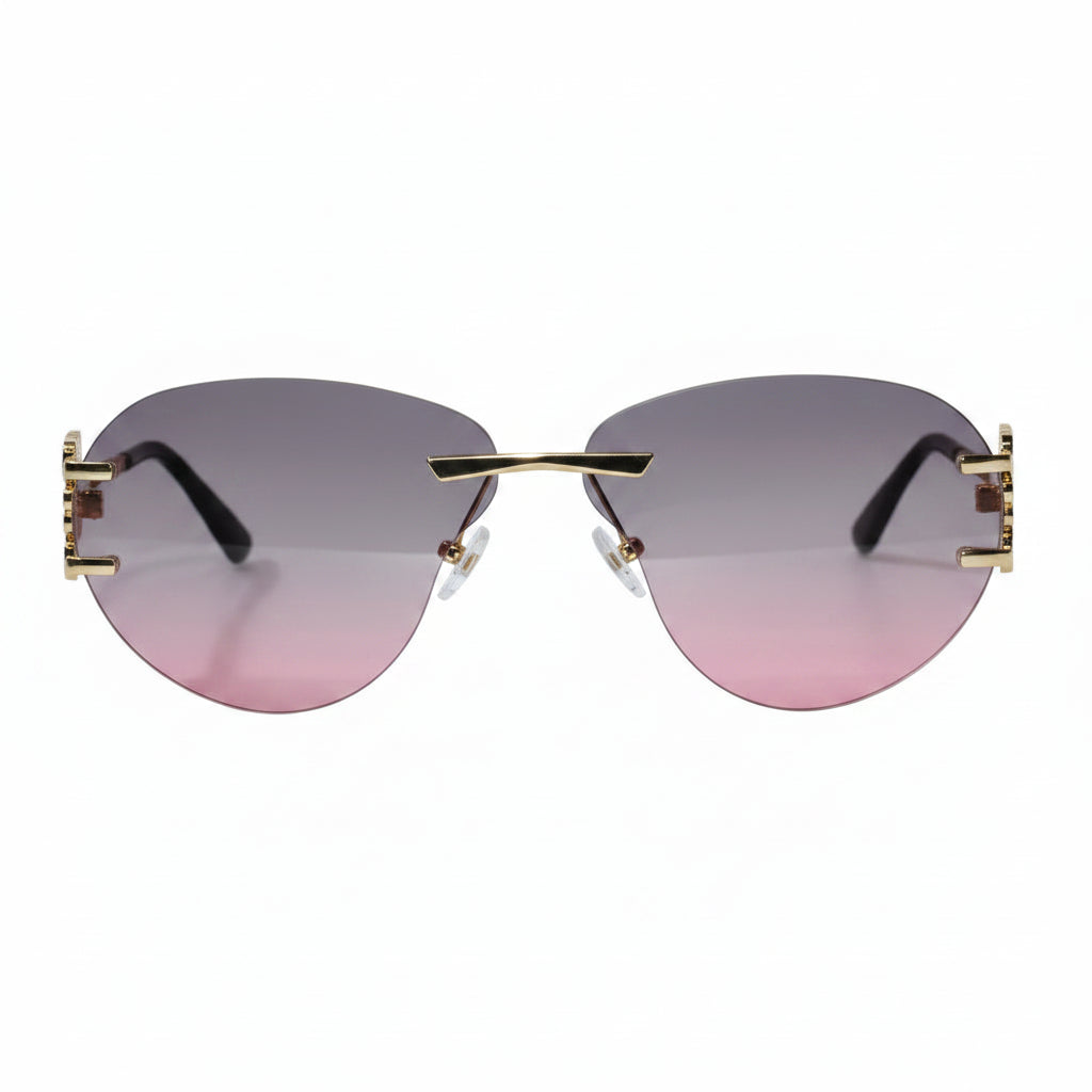 Sunglasses with gold frame and pink gradient lenses on a white background