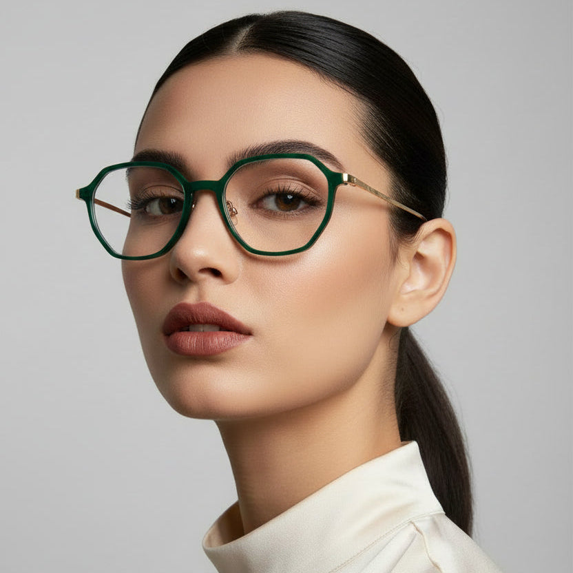 Oversized round eyeglasses with a dark green acetate frame, gold metal bridge and hinge accents, and clear lenses, shown against a plain white background.